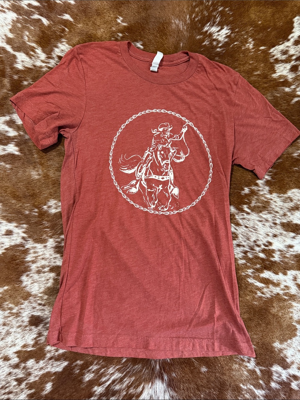 Bella Canvas Rust Red Short‑Sleeve Tee with White Cowboy Graphic